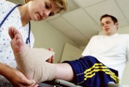 getty_rf_photo_of_nurse_applying_compression_to_minor_injury